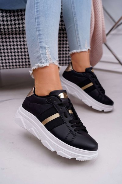 Спортивне жіноче взуття на товстій підошві чорного кольору