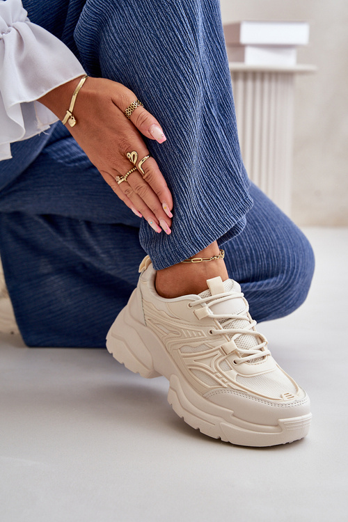 Жіночі спортивні кросівки на масивній підошві світло-бежевого кольору Lerista