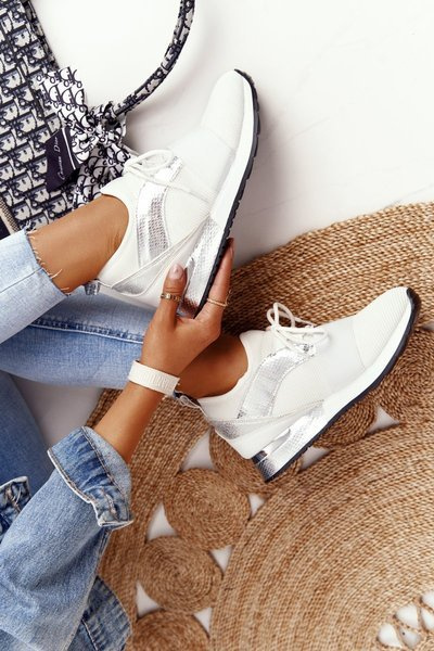 Жіноче спортивне взуття Кросівки біло-сріблясті Netta