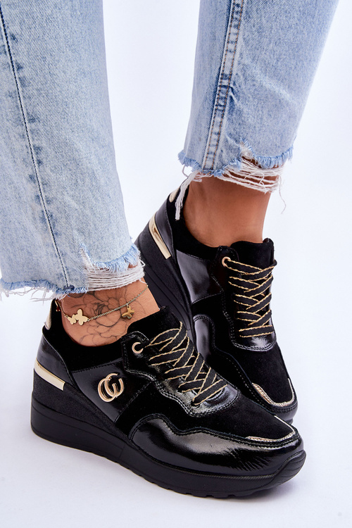 Жіноче шкіряне спортивне взуття на танкетці чорного кольору Rebeca