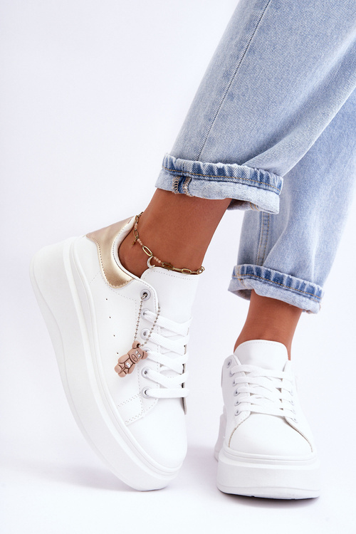 Жіноче спортивне взуття на масивній платформі біло-золоте Mariell