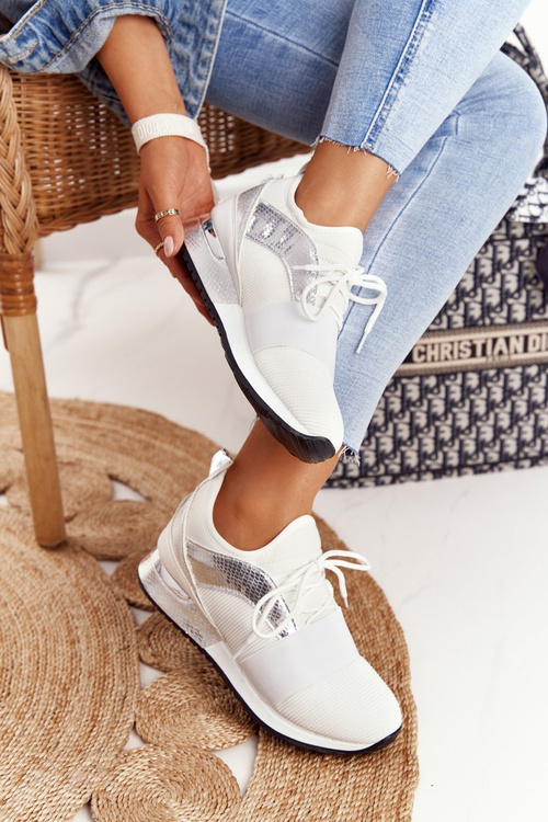 Жіноче спортивне взуття Кросівки біло-сріблясті Netta