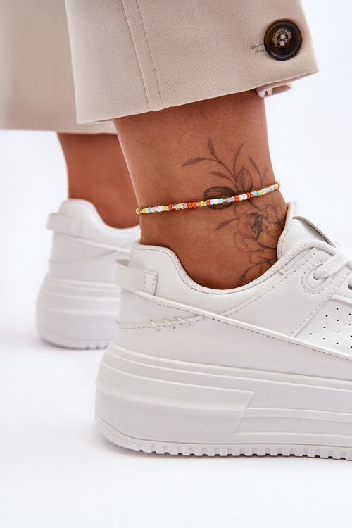 Жіноче шкіряне спортивне взуття на масивній платформі білого кольору Belisso