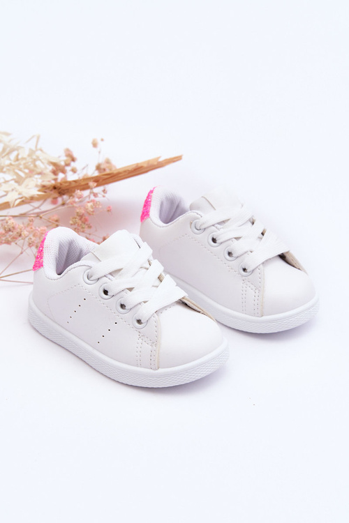Дитяче спортивне взуття білого та неоново-рожевого глянцевого кольору