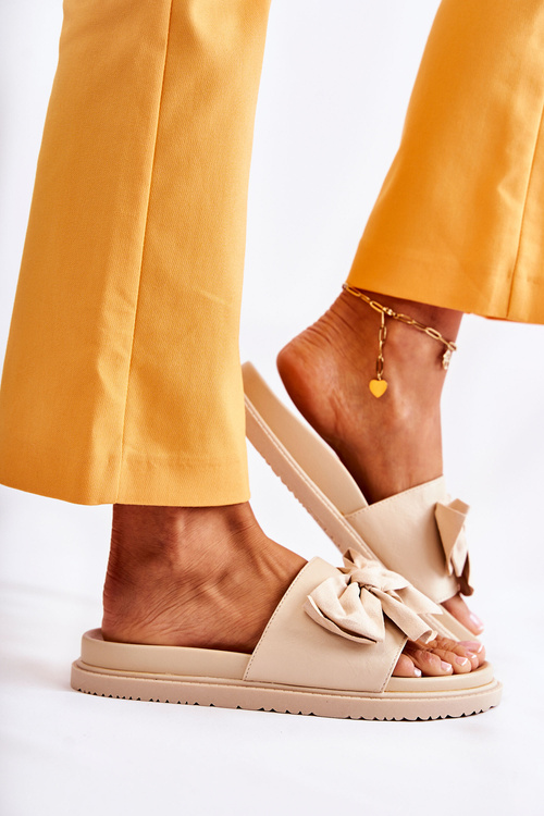 Класичні жіночі шкіряні тапочки з бантом бежеві Dessy