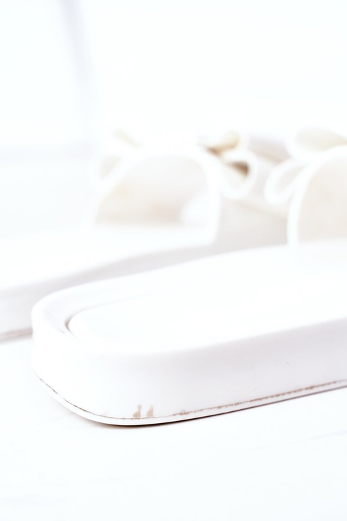 Гумові тапочки з бантом білі квітня