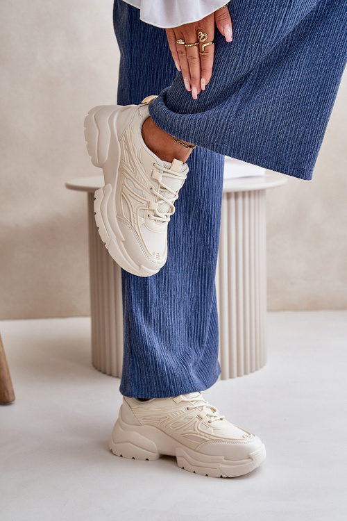 Жіночі спортивні кросівки на масивній підошві світло-бежевого кольору Lerista