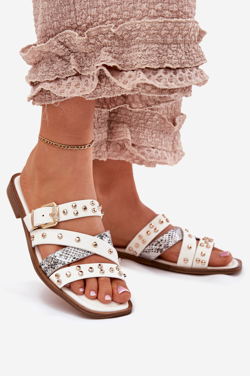 Декоровані жіночі сандалі на плоскому каблуку з ремінцями та пряжкою білі Manitte