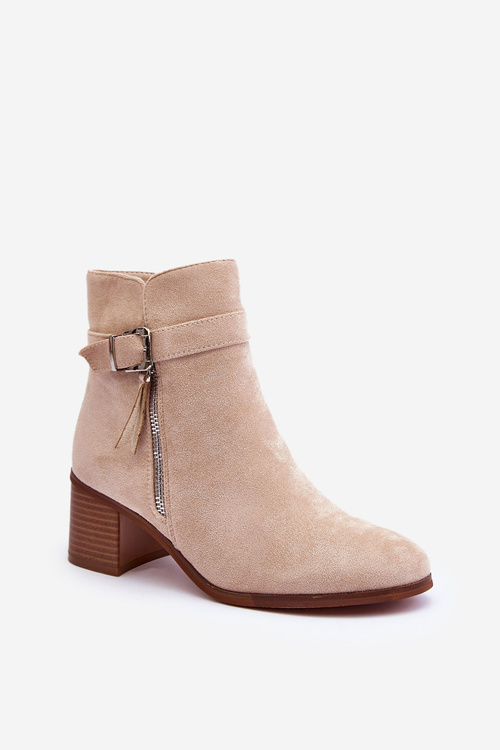 Бежеві шкіряні чоботи з каблуком із пряжкою