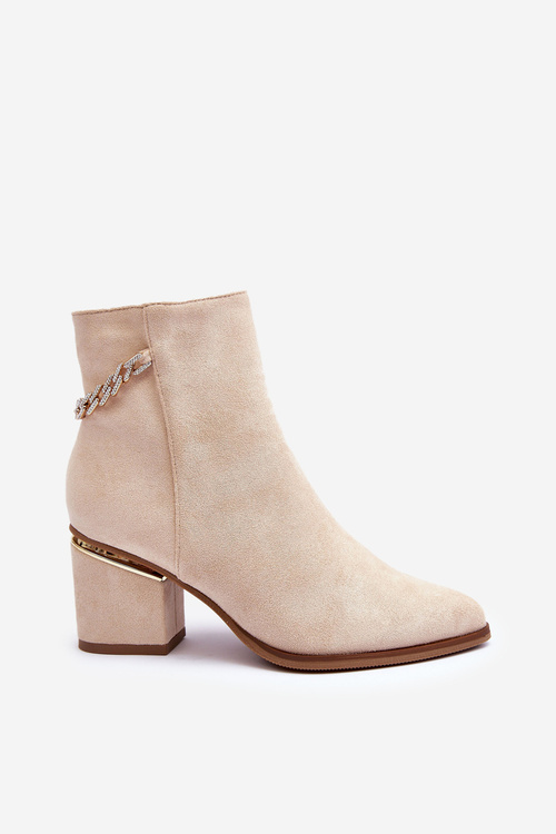 Бежеві шкіряні чоботи з ювелірними прикрасами