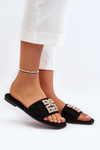 Жіночі босоніжки на плоскій підошві з декором чорного кольору
