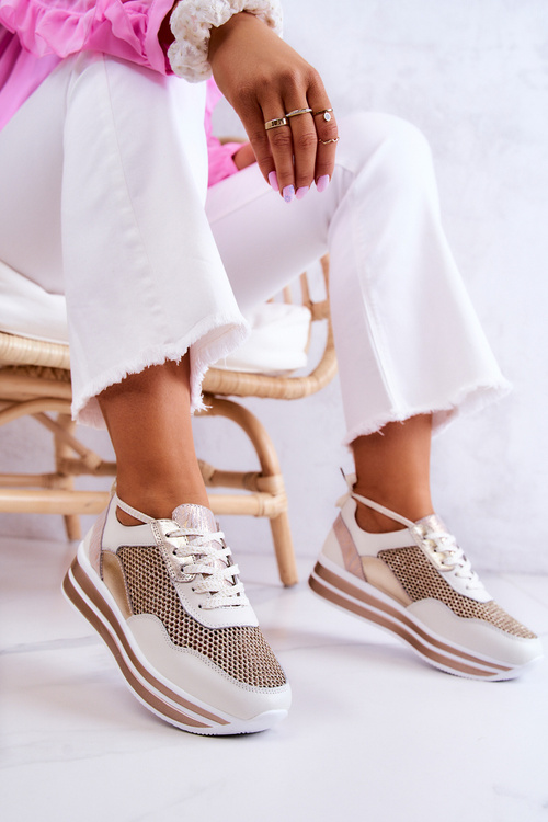 Жіноче спортивне взуття Кросівки біло-золоті Борн