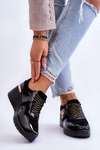 Жіноче шкіряне спортивне взуття на танкетці чорного кольору Rebeca