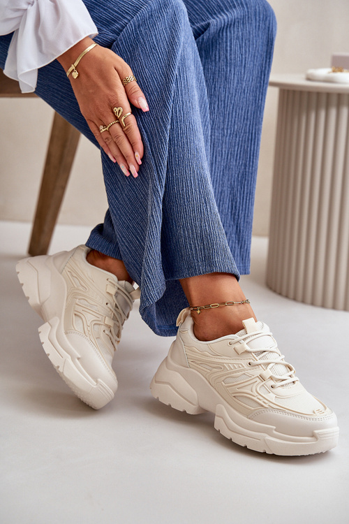 Жіночі спортивні кросівки на масивній підошві світло-бежевого кольору Lerista