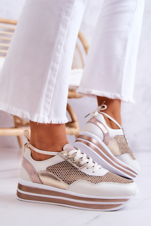 Жіноче спортивне взуття Кросівки біло-золоті Борн