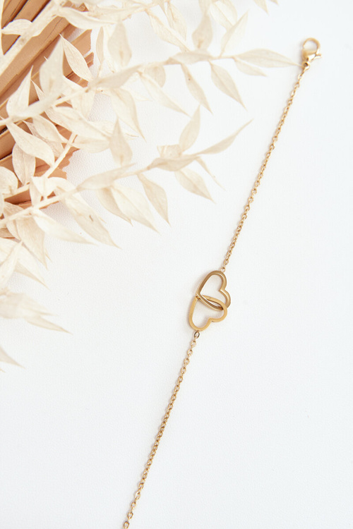 Ніжний браслет із золотими сердечками