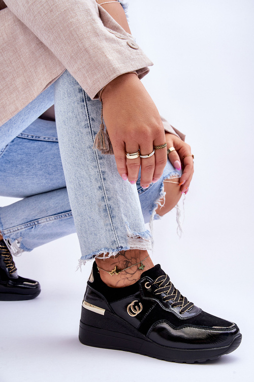 Жіноче шкіряне спортивне взуття на танкетці чорного кольору Rebeca