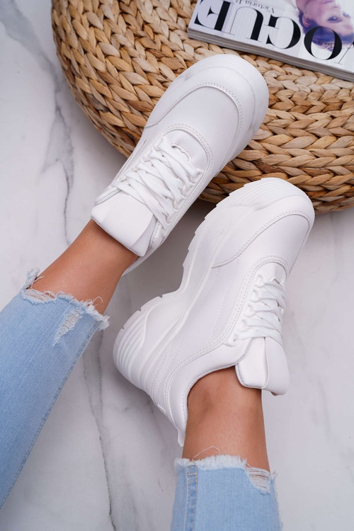 Жіноче спортивне взуття на високій підошві білі гучніше