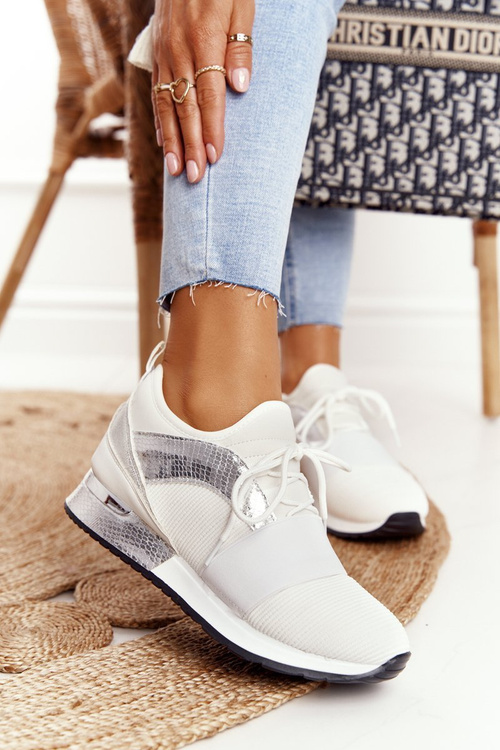 Жіноче спортивне взуття Кросівки біло-сріблясті Netta