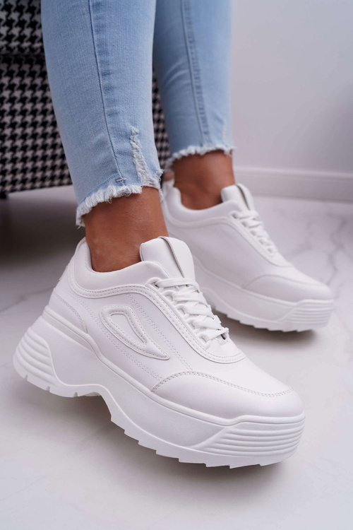 Жіноче спортивне взуття на високій підошві білі гучніше