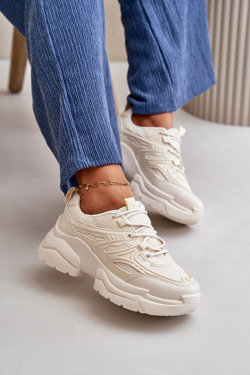 Жіночі спортивні кросівки на масивній підошві світло-бежевого кольору Lerista