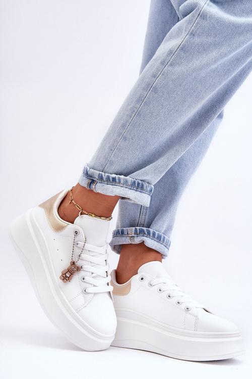 Жіноче спортивне взуття на масивній платформі біло-золоте Mariell