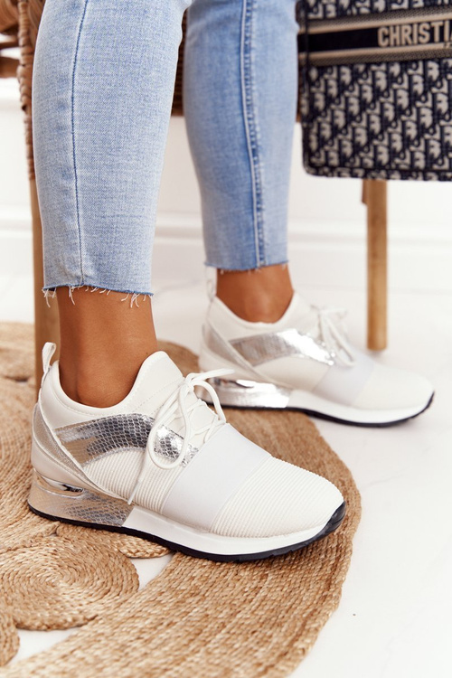 Жіноче спортивне взуття Кросівки біло-сріблясті Netta