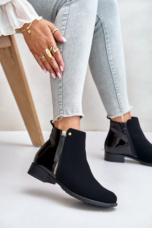 Утеплені ботильйони на плоскому каблуці та низькій халяві чорного кольору Zinariella