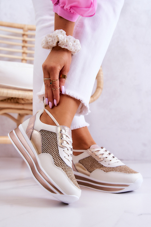 Жіноче спортивне взуття Кросівки біло-золоті Борн