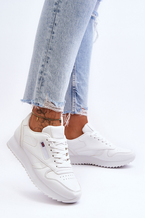 Шкіряне спортивне взуття на платформі білого кольору Merida