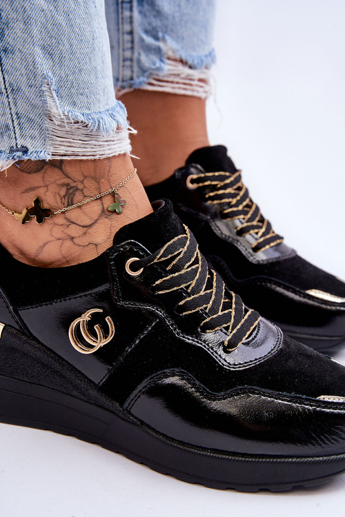 Жіноче шкіряне спортивне взуття на танкетці чорного кольору Rebeca