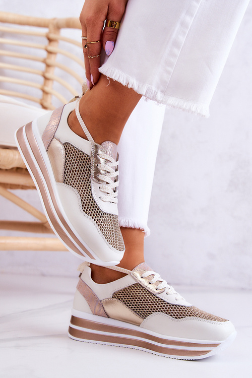 Жіноче спортивне взуття Кросівки біло-золоті Борн