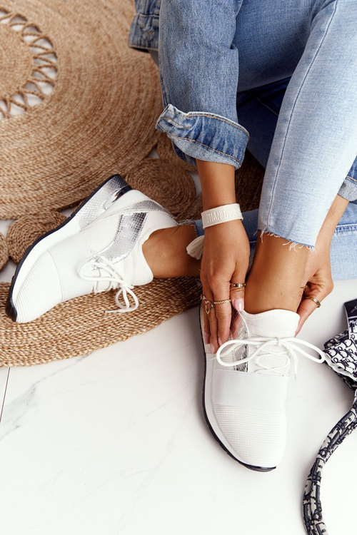 Жіноче спортивне взуття Кросівки біло-сріблясті Netta